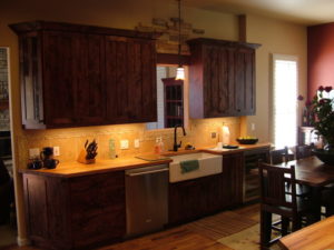 custom kitchen remodel wood counters wood cabinets wood floor stainless appliances custom tile