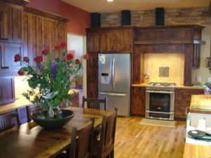 custom kitchen remodel wood counters wood cabinets wood floor stainless appliances custom tile