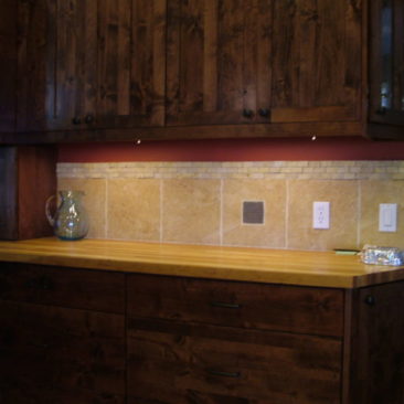 custom kitchen remodel wood counters wood cabinets wood floor stainless appliances custom tile